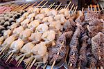 Frogs legs and snake skin at Donghuamen Yeshi night market, Beijing, China, Asia