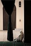 Woman sitting in the Mosque of Al-Hakim, Cairo, Egypt, North Africa, Africa