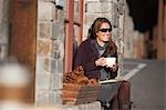 Woman sitting at Cafe, Truckee, near Lake Tahoe, California, USA