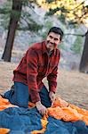 Man Setting up Tent, Truckee, near Lake Tahoe, California, USA