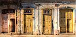 Facades of dilapidated colonial buildings bathed in evening light, Havana, Cuba, West Indies, Central America