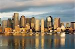 The skyline of the Financial District across Boston Harbor at dawn, Boston, Massachusetts, USA