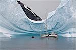 Sailing yacht and iceberg, Errera Channel, Antarctic Peninsula, Antarctica, Polar Regions