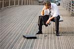 Depressed man on bridge, Paris, France, Europe