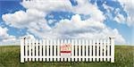 White Picket Fence with Sold Sign in Open Field