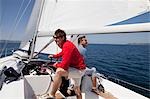 Two men setting sail on yacht