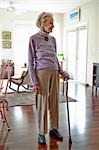 Senior woman standing in her living room