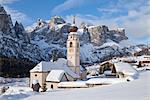 The church and village of Colfosco in Badia, 1645, and Sella Massif range of mountains under winter snow, Dolomites, South Tirol, Trentino-Alto Adige, Italy, Europe