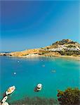 Acropolis overlooking bay, Lindos, Rhodes, Dodecanese, Greek Islands, Greece, Europe