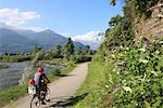 Family riding bicycle in Colico, Lake Como, Italian Lakes, Lombardy, Italy, Europe