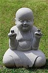 Stone statue of happy Buddha