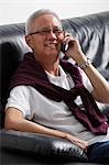 older man talking on phone and smiling