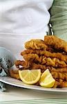 Several Wiener Schnitzel (breaded veal escalopes) on plate