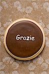 A biscuit with the word 'Grazie'