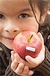 Girl with an organic apple