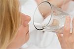 Woman drinking a glass of mineral water