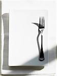 A fork on a white platter