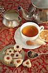 Tea with sugar crystals and biscuits