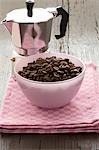 Espresso pot with a small bowl of espresso beans