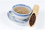 Cup of tea with Semen cassiae in a bamboo cane