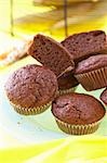 Several chocolate banana muffins in paper cases