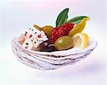 Feta with olives and chillies in a shell