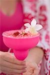 Woman holding summery strawberry drink