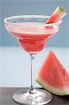 Watermelon drink in a glass with a sugared rim