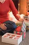 Woman opening boxes of Christmas decorations