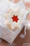 Jam-filled star biscuit on white box (Christmas)