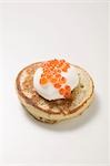 Blini with sour cream and caviar