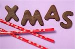 Letter biscuits (spelling the word XMAS) and straws