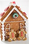 Gingerbread house with two gingerbread men