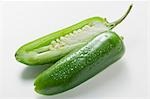 Green chilli with drops of water, halved