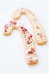Two Christmas biscuits in the shape of candy canes