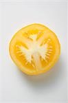 Half a yellow tomato (overhead view)