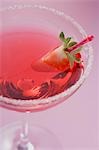 Martini with liqueur & strawberry in glass with sugared rim