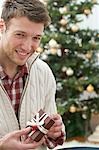 Man holding Christmas parcel