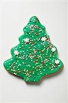 Christmas tree biscuit decorated with hundreds & thousands