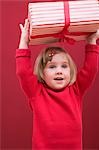 Small girl holding Christmas parcel