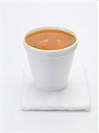 Tomato and vegetable soup in polystyrene cup