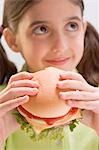 Little girl holding cheeseburger