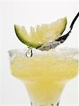 Frozen Margarita, lime wedge on spoon