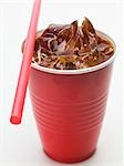 Cola with ice cubes in a plastic cup