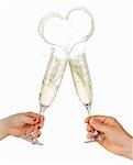 Clinking glasses of sparkling wine (with heart-shaped splash)