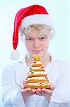 Girl holding biscuit Christmas tree