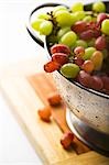 Fresh Red and Green Grapes in a Colander