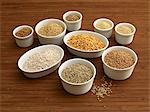 Various types of cereal grains in small bowls