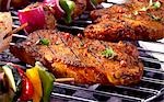 Pork steaks on barbecue