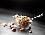 Peanuts in glass dish with spoon